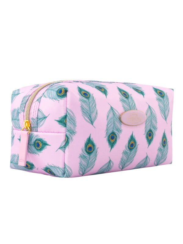 Angled shot of synthetic pale pink cosmetic bag, Their Nibs badge in centre, peacock feather pattern