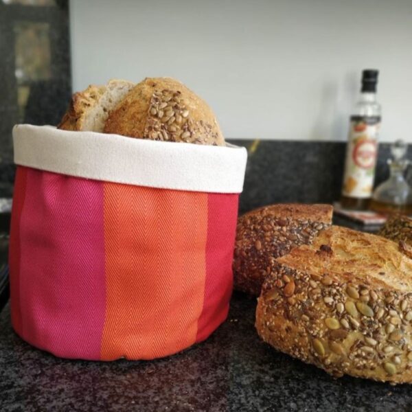 red orange pink bread basket fabric storage over-kitchen-black-marble-top-with-Bread-in-and-out