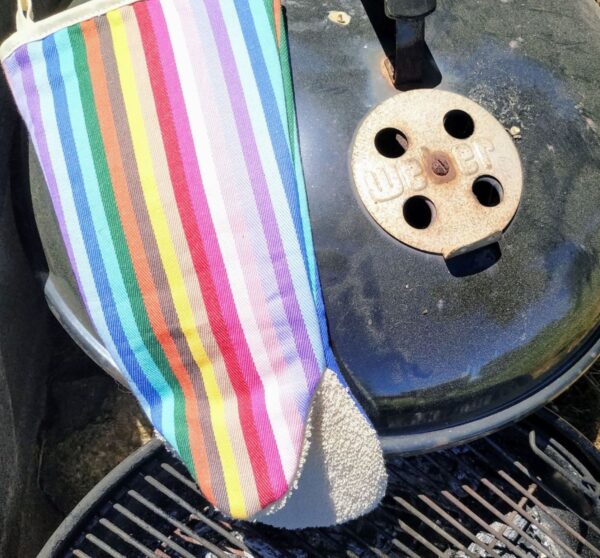 rainbow o long oven glove on an old Weber Barbeque