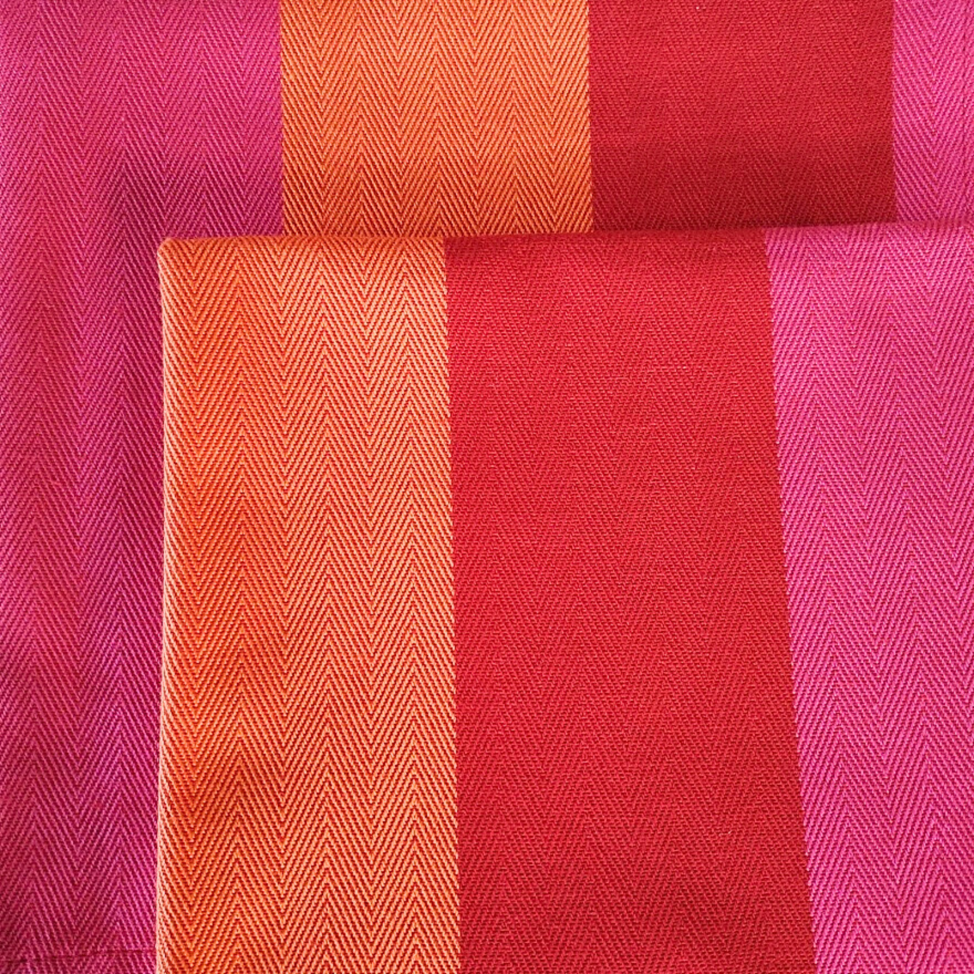 red orange pink napkins close up folded above each other
